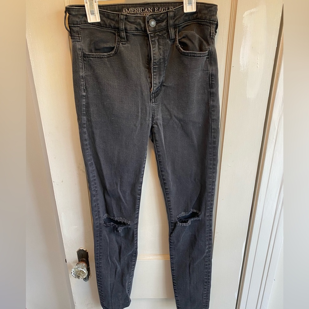 Black ripped knee jeans